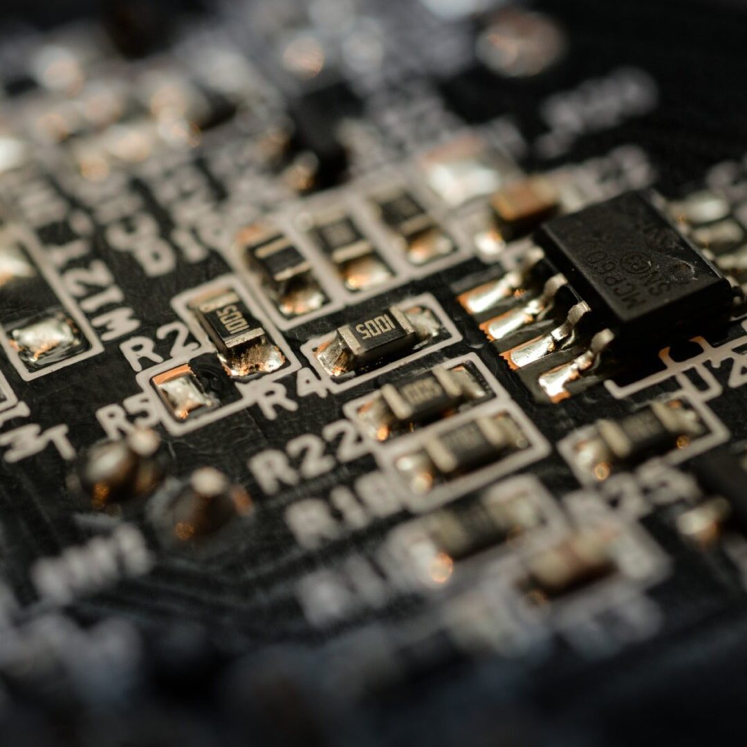 A close up of the electronic components on a circuit board.